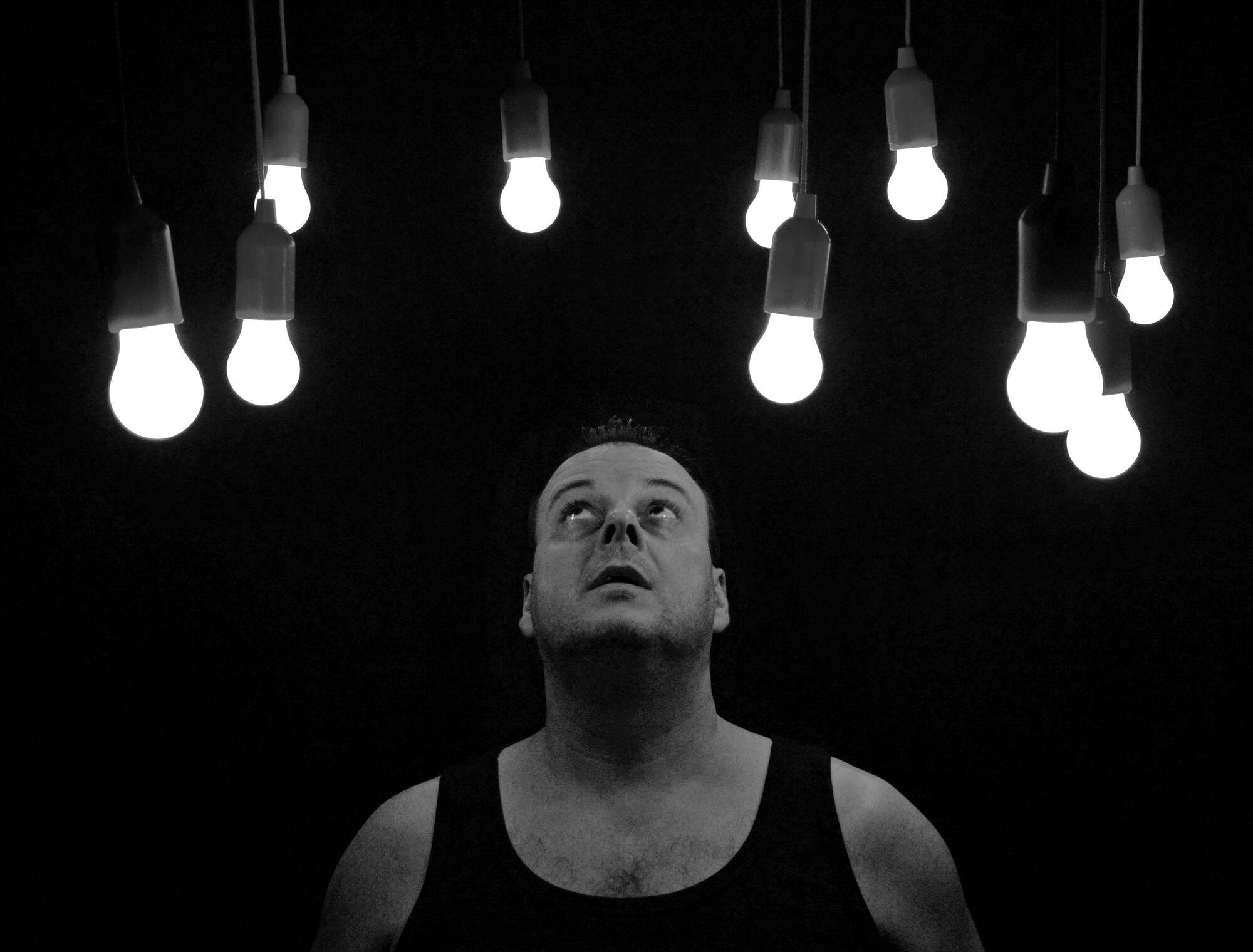 guy looking at light bulbs