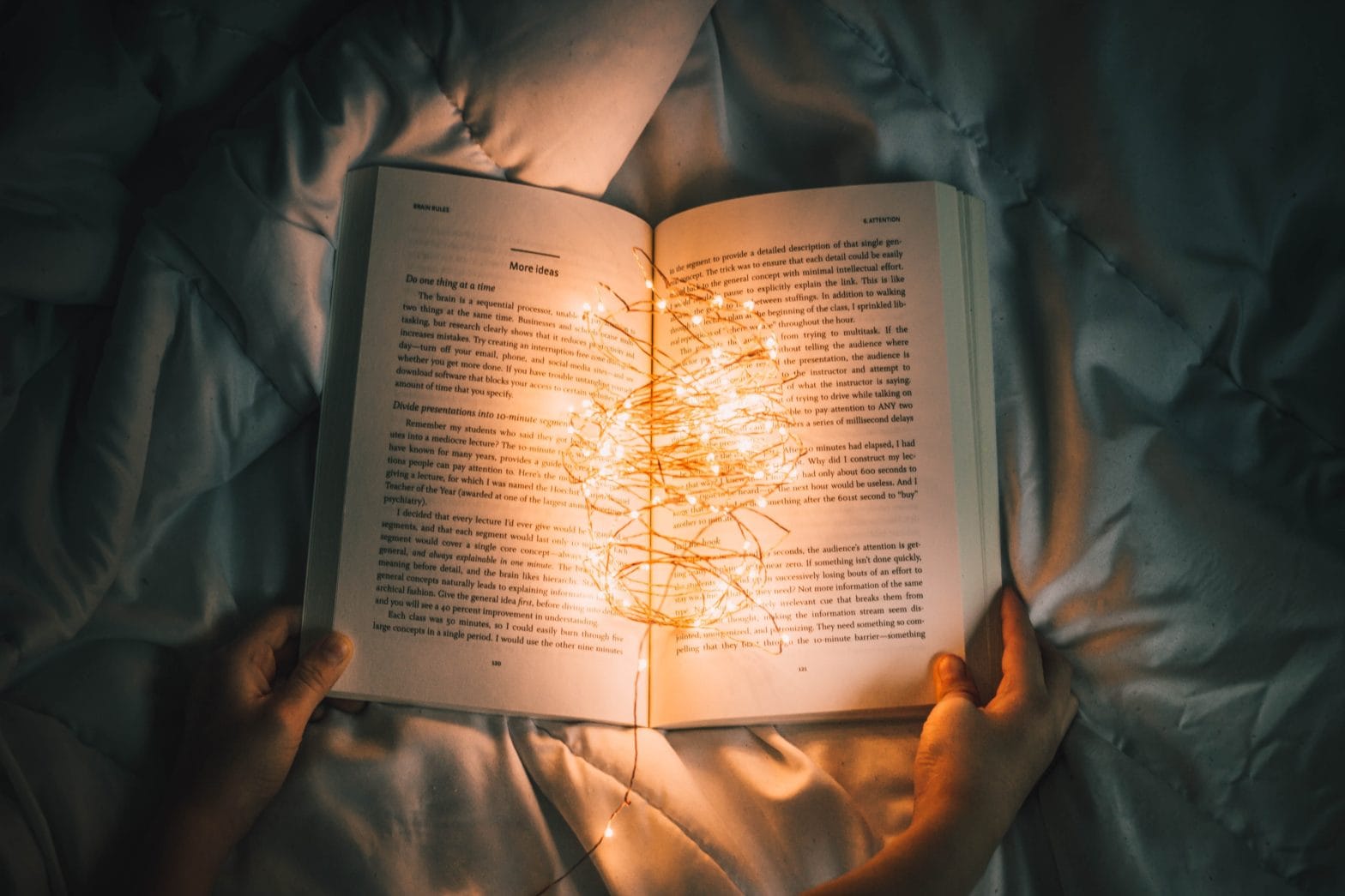 A book that is lit up with bright lights that illuminate the pages